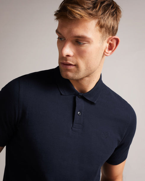 DELVIN-Tops-Dive into DELVIN. This essential polo shirt covers all the bases with a flattering fit, collar, and short sleeves. Paired with jeans and trainers, this top is perfect for spontaneous visits to the farmer's market or can be dressed up with tailored trousers and boots for a smart-casual look. By choosing Ted Baker cotton products, you're supporting our investment in the Better Cotton Initiative's mission. This product is sourced via a system of mass balance and therefore may not contain better cot